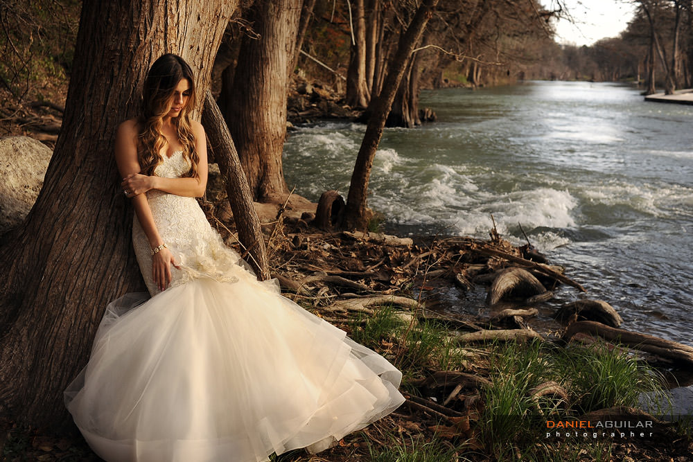 Bride in Gruene Tx river Gruene TX trash the dress at sunset on the shore of Guadalupe River