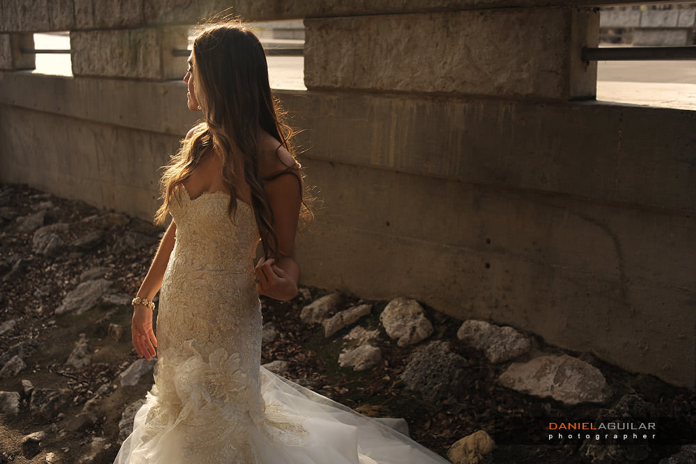 Beautiful sunset light portrait of a bride at the side of the street