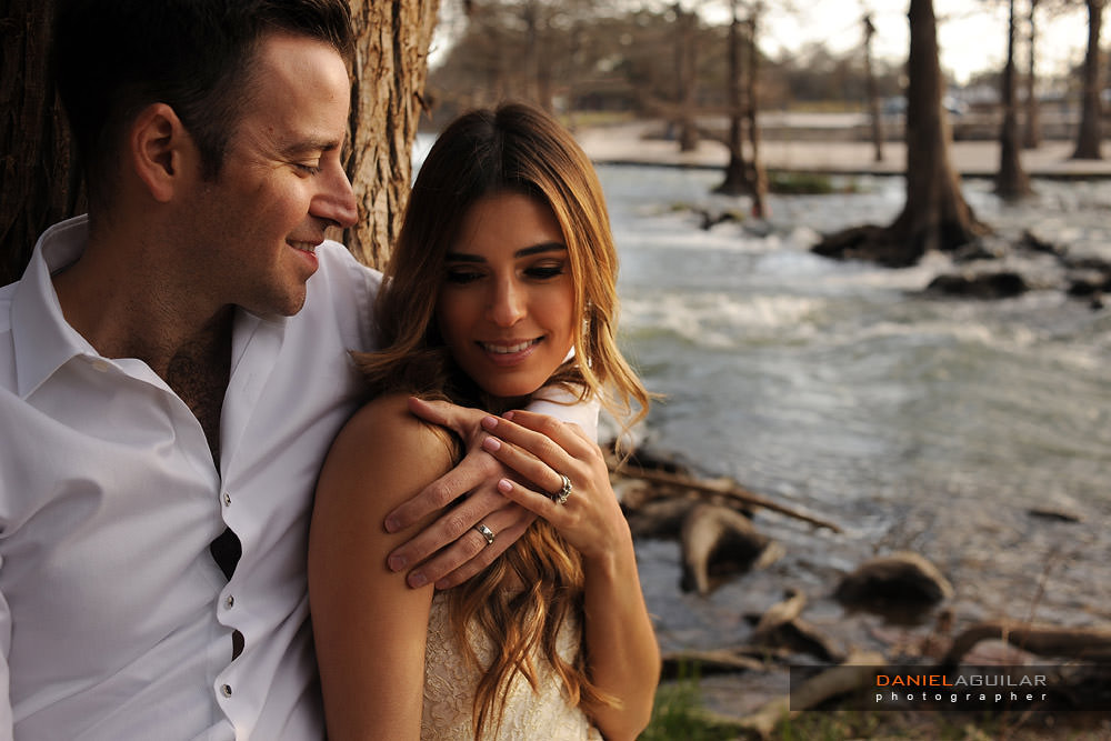 Couple posing in Guadalupe River TX Groom looking at his bride in a romantic way