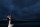 a wedding photo of a couple dancing on the outside of the lakeway resort in austin texas with a evening blue sky in the background